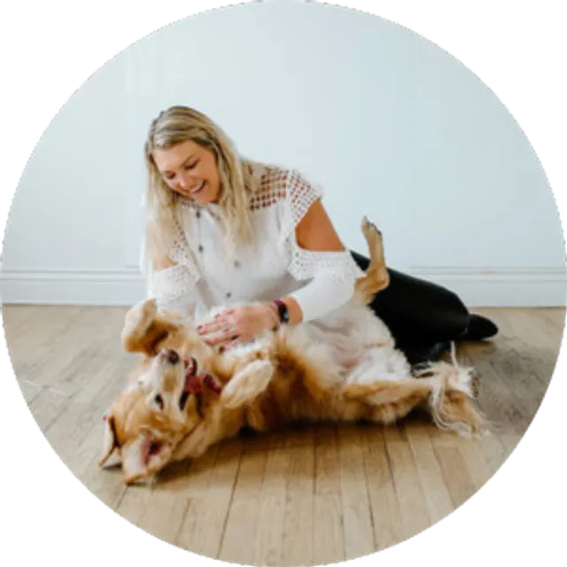 Hannah Snider spending time with Lola and another therapy dog