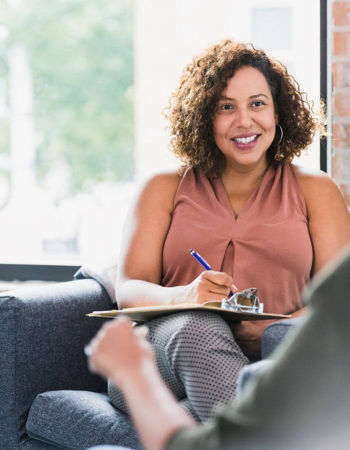 A therapist listening during an individual counseling session.